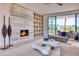 Contemporary living room featuring a modern fireplace and open shelving at 6215 N Casa Blanca Dr, Paradise Valley, AZ 85253