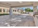 Elegant outdoor patio with stone flooring, lounge chairs, and a well-equipped outdoor kitchen at 6215 N Casa Blanca Dr, Paradise Valley, AZ 85253