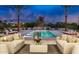 Relaxing poolside view with comfortable seating, ambient lighting, and lush landscaping creating a serene retreat at 6215 N Casa Blanca Dr, Paradise Valley, AZ 85253