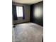 A bedroom featuring plush carpeting, neutral walls, and black trim at 815 W Kiva Ave, Mesa, AZ 85210
