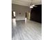 An open-concept living room featuring a ceiling fan and arched doorways leading to other rooms at 815 W Kiva Ave, Mesa, AZ 85210