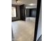A living room features tile floors and access to other rooms through an arched doorway at 815 W Kiva Ave, Mesa, AZ 85210
