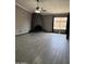 Spacious living room with tile flooring, fireplace, ceiling fan, and natural light from a window at 815 W Kiva Ave, Mesa, AZ 85210