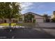 Single-story home with attached two-car garage and lush landscaping at 931 E Eveningstar Ln, Tempe, AZ 85283