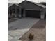 Single-story house with a two-car garage and a gravel driveway at 1241 E Paul Dr, Casa Grande, AZ 85122