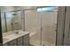 Elegant bathroom featuring a double vanity and a large walk-in shower at 12461 W Midway Ave, Glendale, AZ 85307