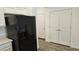 Black refrigerator in a modern kitchen setting at 12461 W Midway Ave, Glendale, AZ 85307