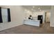 Modern kitchen featuring white cabinets, a breakfast bar, and dark appliances at 12461 W Midway Ave, Glendale, AZ 85307