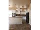 Bright kitchen featuring white cabinetry, stone countertops, stainless steel appliances, and tiled backsplash at 1480 E Harrison St, Gilbert, AZ 85295