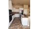 Well-equipped kitchen with white cabinets, stainless steel appliances, tile backsplash, and stone countertops at 1480 E Harrison St, Gilbert, AZ 85295
