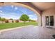 Spacious backyard with covered patio and lush lawn at 18654 W Solano Dr, Litchfield Park, AZ 85340
