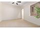 Spacious bedroom with neutral carpeting and large window at 18654 W Solano Dr, Litchfield Park, AZ 85340