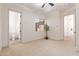 Bright bedroom with carpet, ceiling fan, and en-suite bathroom at 18654 W Solano Dr, Litchfield Park, AZ 85340