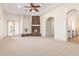 Primary bedroom with stone fireplace and French doors at 18654 W Solano Dr, Litchfield Park, AZ 85340