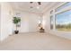 Large bedroom with fireplace and lots of natural light at 18654 W Solano Dr, Litchfield Park, AZ 85340