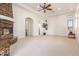 Primary bedroom with fireplace and access to bathroom at 18654 W Solano Dr, Litchfield Park, AZ 85340