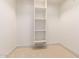 Spacious closet with three shelves for storage at 18654 W Solano Dr, Litchfield Park, AZ 85340