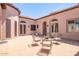 Spacious paved courtyard with seating area and access to the home at 18654 W Solano Dr, Litchfield Park, AZ 85340