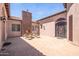 Courtyard with fireplace and seating area, perfect for relaxing at 18654 W Solano Dr, Litchfield Park, AZ 85340