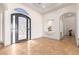 Bright and spacious entryway with high ceilings and an ornate door at 18654 W Solano Dr, Litchfield Park, AZ 85340