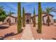 Tuscan style home with palm trees and a walkway at 18654 W Solano Dr, Litchfield Park, AZ 85340