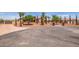 House exterior with gated entry and large paved driveway at 18654 W Solano Dr, Litchfield Park, AZ 85340