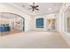 Open Gathering room with views of the kitchen and backyard at 18654 W Solano Dr, Litchfield Park, AZ 85340