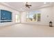 Bright Gathering room with a built-in entertainment center and French doors at 18654 W Solano Dr, Litchfield Park, AZ 85340