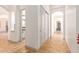 Bright hallway with tile flooring and access to other rooms at 18654 W Solano Dr, Litchfield Park, AZ 85340