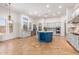 Gourmet kitchen with a large island, stainless steel appliances, and granite counters at 18654 W Solano Dr, Litchfield Park, AZ 85340