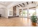 Spacious living room features a stone fireplace and access to the backyard at 18654 W Solano Dr, Litchfield Park, AZ 85340