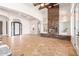 Spacious living room with a stone fireplace and high ceilings at 18654 W Solano Dr, Litchfield Park, AZ 85340