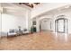 Open living room with high ceilings, tile floors, and a view to the entry at 18654 W Solano Dr, Litchfield Park, AZ 85340