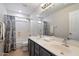 Bathroom with dual sinks, a shower-tub combo with a shower curtain at 19406 N 31St Way, Phoenix, AZ 85050