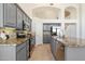 Modern kitchen featuring grey cabinetry, granite countertops, and stainless steel appliances at 19406 N 31St Way, Phoenix, AZ 85050