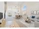 Open-concept living room featuring neutral tones, abundant natural light, and stylish furnishings at 19406 N 31St Way, Phoenix, AZ 85050