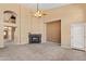 Spacious living room with a cozy fireplace and high ceilings at 19406 N 31St Way, Phoenix, AZ 85050