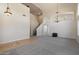 Spacious living room featuring high ceilings, neutral carpet, and an elegant chandelier at 19406 N 31St Way, Phoenix, AZ 85050