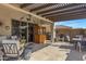 Covered patio with seating area and outdoor bar at 369 W Glacier Bay Dr, San Tan Valley, AZ 85140