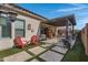 Relaxing backyard with patio, seating, and a pergola at 369 W Glacier Bay Dr, San Tan Valley, AZ 85140
