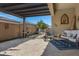 Relaxing patio area with seating and a view of the backyard at 369 W Glacier Bay Dr, San Tan Valley, AZ 85140
