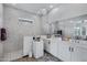 Elegant bathroom with marble tile, walk-in shower, and double vanity at 369 W Glacier Bay Dr, San Tan Valley, AZ 85140