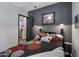 Small bedroom with dark gray walls and full-size bed at 369 W Glacier Bay Dr, San Tan Valley, AZ 85140