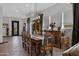 Elegant dining room with wooden table and rustic chairs at 369 W Glacier Bay Dr, San Tan Valley, AZ 85140