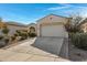 Well-maintained home with a spacious driveway and attractive landscaping at 369 W Glacier Bay Dr, San Tan Valley, AZ 85140