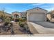 Single-story home with landscaped front yard and two-car garage at 369 W Glacier Bay Dr, San Tan Valley, AZ 85140