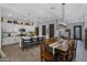 Spacious kitchen with granite countertops, white cabinets, and stainless steel appliances at 369 W Glacier Bay Dr, San Tan Valley, AZ 85140