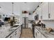Modern kitchen with granite countertops and stainless steel appliances at 369 W Glacier Bay Dr, San Tan Valley, AZ 85140