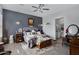 Spacious main bedroom with wood floors and ensuite bathroom access at 369 W Glacier Bay Dr, San Tan Valley, AZ 85140