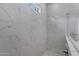 Large walk-in shower with marble tile and glass enclosure at 369 W Glacier Bay Dr, San Tan Valley, AZ 85140